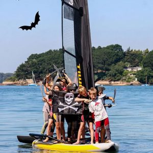 Kids Sailing a Tiwal Inflatable Sailboat for Halloween