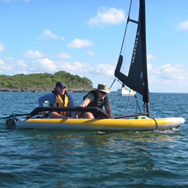 Couple having fun on a Tiwal 3 inflatable sailing boat