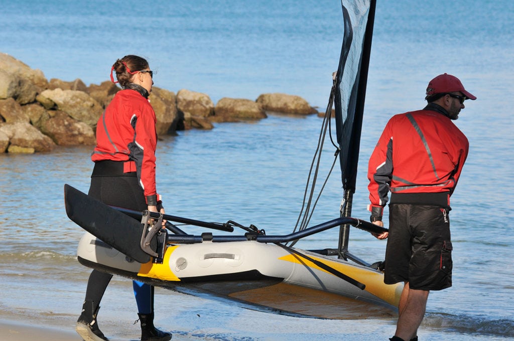 Bringing Tiwal Sailboat close to the water