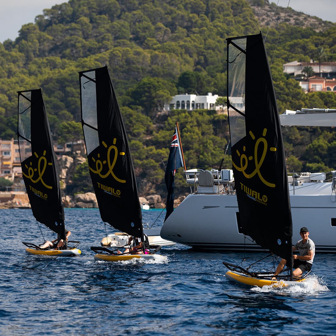 A fleet of Tiwal 3 inflatable sailing dinghies racing in Palma de Mallorc