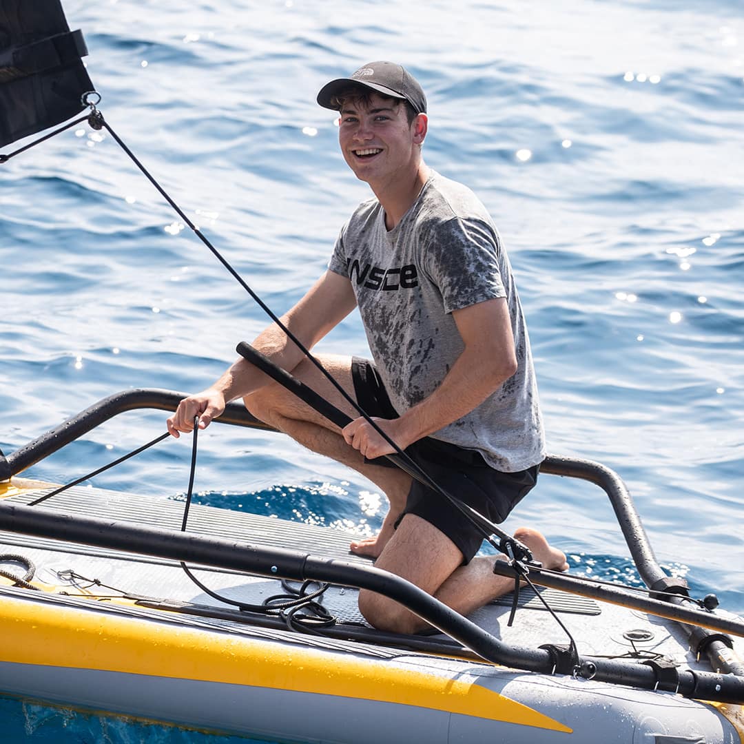 Young sailor onboard a Tiwal 3 small inflatable dinghy
