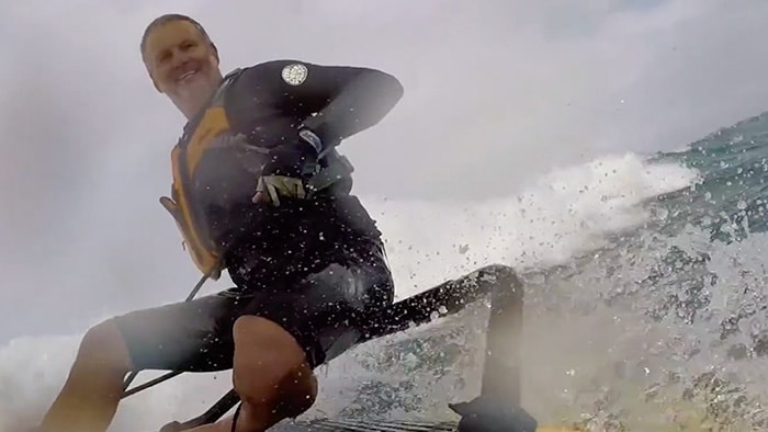 Dinghy sailing in the waves in Hawaii