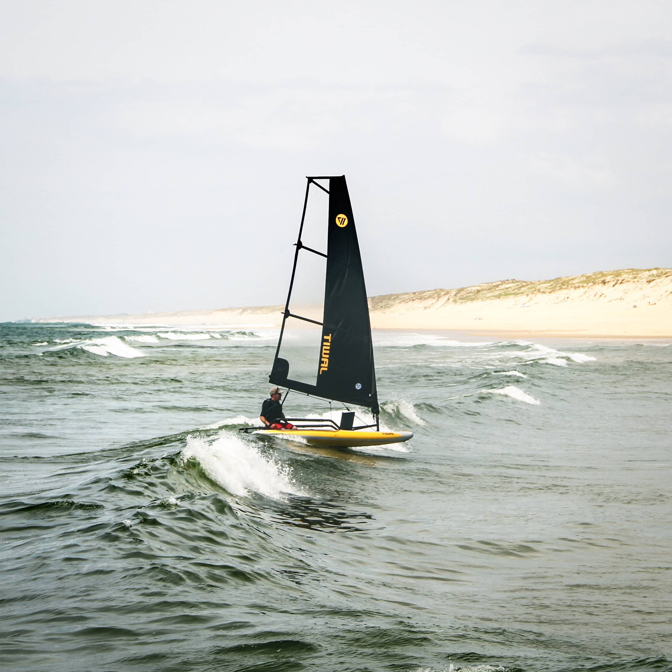 Tiwal sailboats in waves