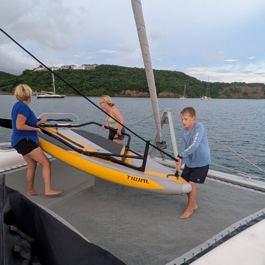 Lauching a Tiwal 3 sailing dinghy from a catamaran