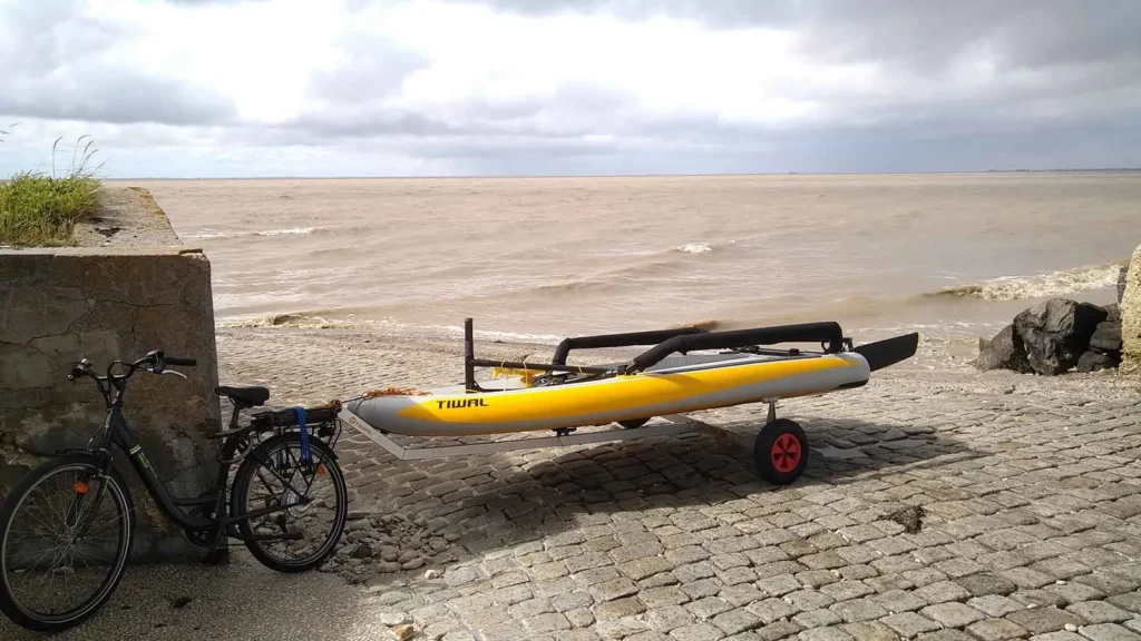 FAQ | How do Tiwal Captains Transport their Tiwal? | Tiwal dinghy hull towed behind a bike Tiwal dinghy hull towed behind a bike