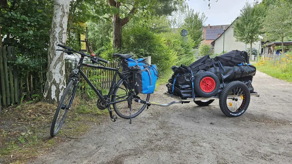 FAQ | How do Tiwal Captains Transport their Tiwal? | Tiwal sailboat on a trailer towed behind a bicycle Tiwal sailboat on a trailer towed behind a bicycle